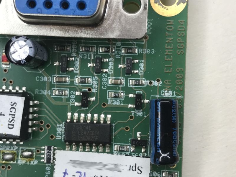 Close-up of PCB labeled SGPSD4 with ICs, capacitors, and Polish text markings.