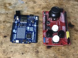 Arduino R4 WiFi and Joystick Shield on a Desk Arduino R4 WiFi and Joystick Shield on a wooden desk