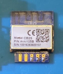CB2S module with model name and serial number on a blue background, visible solder pads.