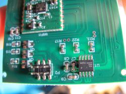 Electronic module with Hellosi H8G3006 M1BN6 chip and pin header on a green PCB.