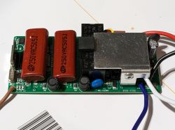 Ceiling Fan Remote Control Circuit Board Circuit board of a ceiling fan remote control showing capacitors and components.