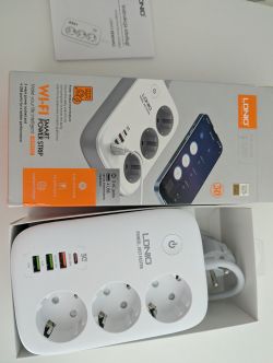 LDNIO power strip with three sockets and four USB ports in open packaging