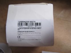 Product label on a white box Label with barcode and product information on a white box.