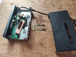 LN882H development board on a wooden table with an open case lid and a cable.