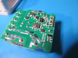 Image of a green PCB labeled DS-1311WN V1.2 with electronic components and a button.