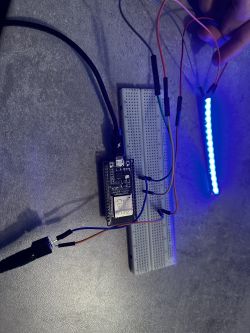Breadboard with connected ESPHome and a blue-lit WS2812B LED strip.