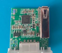Close-up of a circuit board featuring a chip labeled CKW04.