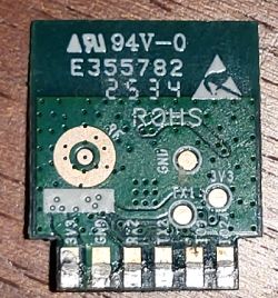 Small PCB module with markings, connectors, and circuit traces