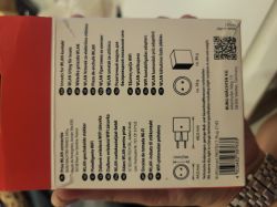 Back of WLAN socket packaging with text, icons, QR code, and barcode.