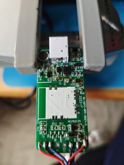 Close-up of a circuit board with a microphone and USB connector.
