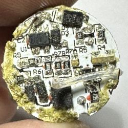 Close-up of a circuit board from inside an LED light bulb.