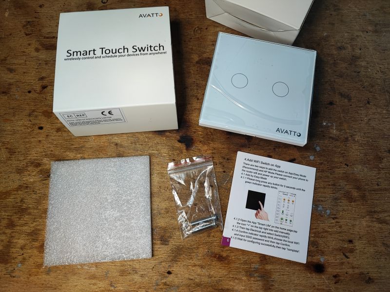 Avatto Zigbee Smart Light Switch Set Avatto Zigbee smart light switch set on a wooden surface.