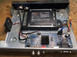 Installed Samsung 870 EVO 4TB SSD inside a metal casing with a motherboard