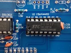 Close-up of a PCB with an STC 8G1K17 DIP IC in a socket and labeled 10k resistors