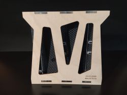 Wooden stand with cutouts on a black background.