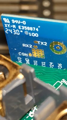 Close-up of a circuit board with markings RX2, TX2, and CSN.