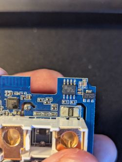 Blue Printed Circuit Board with Electronic Components Close-up of a blue printed circuit board with visible electronic components.