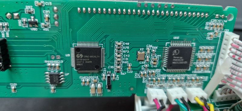 Circuit Board with Microcontrollers in a Three-Phase Energy Meter Close-up of a circuit board with visible microcontrollers.