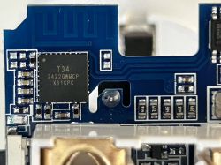 Close-up of a circuit board with a T34 2422GWMCP X31CPC microchip.