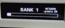 OLED display showing information for bank 1 and network update enabled.