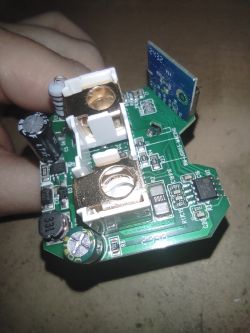 Inside view of a Zigbee smart socket’s PCB A Zigbee socket’s circuit board with visible capacitors, ICs, and power terminals.
