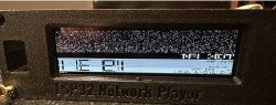 Distorted screen on an ESP32 network player with visible interference.