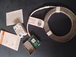 Sylvania LED Strip Kit with Control Module and Instructions Sylvania LED strip with control module and documentation on dark surface