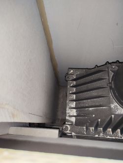 Interior view of a fireplace with panel cladding.
