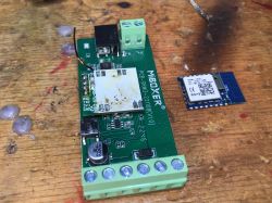 Photo of a MiBoxer electronic module on a workshop table.