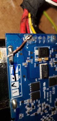 Close-up of a circuit board with wires and electronic components.