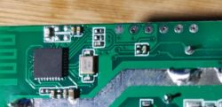 Printed circuit board with visible traces, components, and solder pads.