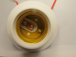 Light Bulb Socket Light bulb socket with visible metal components and electrical wires.