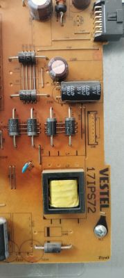 Close-up of a VESTEL 17IPS72 power supply PCB with capacitors, diodes, and a transformer