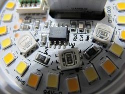 Circuit board with electronic components, including LEDs and an integrated circuit.