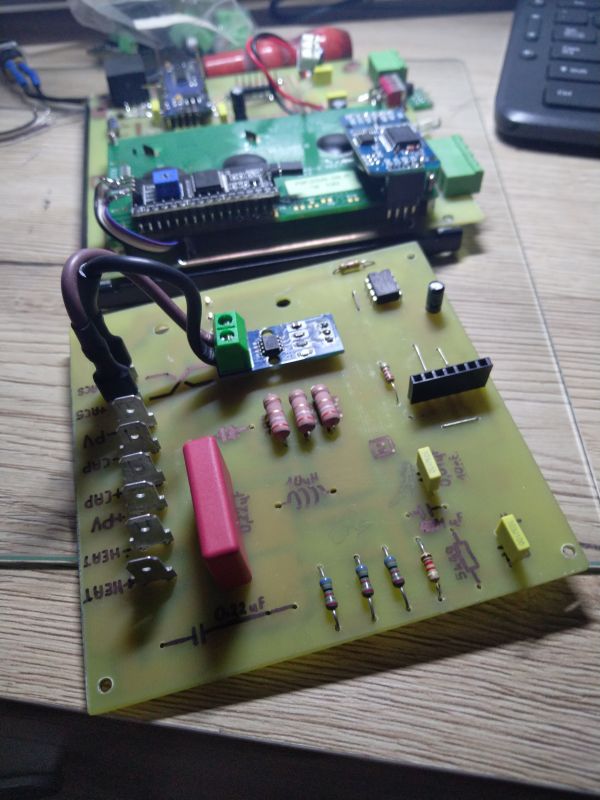 DIY Printed Circuit Board Printed circuit board with electronic components on a desk.