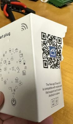 Smart Plug Packaging with QR Code Smart plug packaging with QR code and app icon.