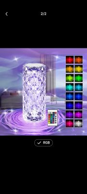 Crystal LED Lamp with Remote and Color Options Crystal LED lamp glowing purple with a remote control for color changes.