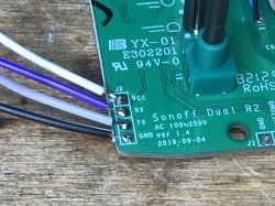 Sonoff Dual R2 Board with Connected Wires Close-up of a Sonoff Dual R2 circuit board with visible soldering points and wires.