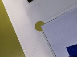 White rounded corner with flat material installed on green background