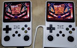 Two white handheld consoles showing differences in display quality