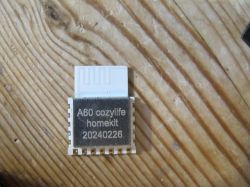 A60 Cozylife Homekit Module A60 Cozylife Homekit module on a wooden surface