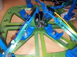 Mini Smart Switch PCB with components on top, placed in a specialized holder.