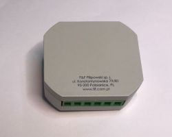 Gray electrical module with green connectors and F&amp;F Filipowski company data printed on top.