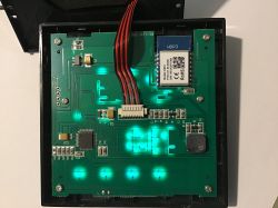 Internal view of a thermostat with a WBR3 module on a green PCB.