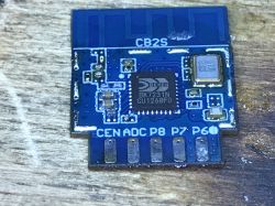 Close-up of the CB2S BK7231N module with visible pads and microchip.