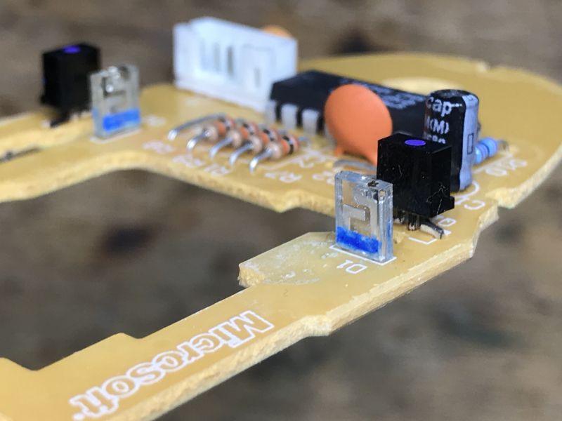 Inside of a Computer Mouse Circuit Board Circuit board of a computer mouse with electronic components.