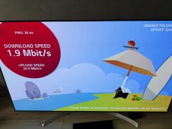 Ekran z wynikami prędkości internetu pokazujący pobieranie 1,9 Mbit/s i wysyłanie 20,0 Mbit/s.