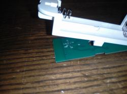 Interior of a Case with Circuit Board Interior of a plastic case with a visible section of a circuit board featuring pin labels.