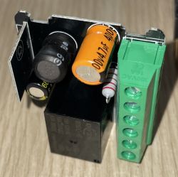 Electronic board with capacitors and connector.