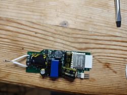 Electronic Module with Components Electronic module with components on a wooden surface.